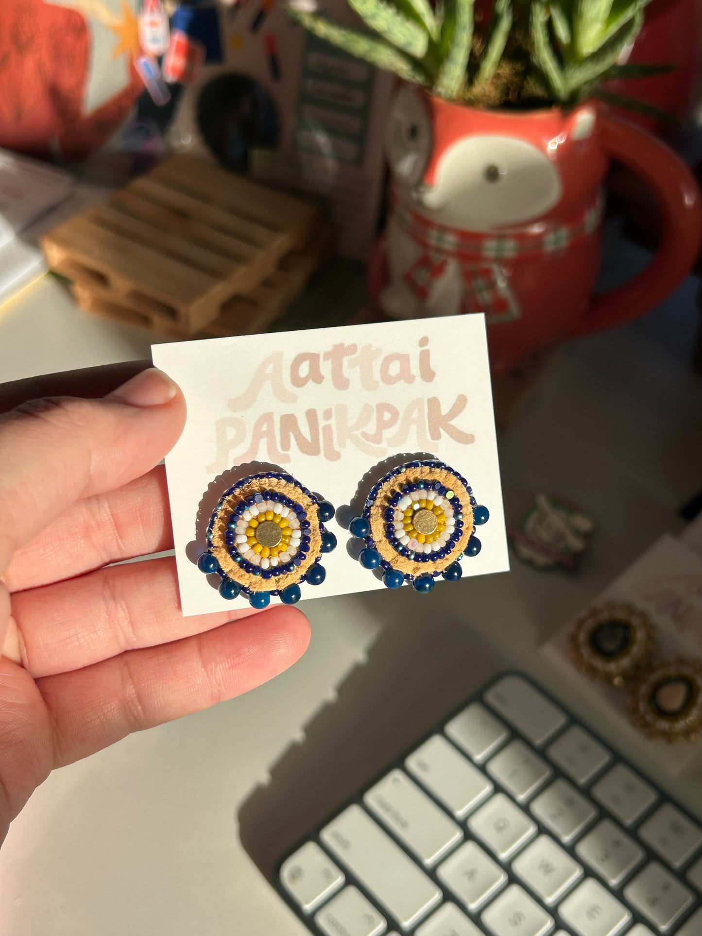 Blue and gold studs