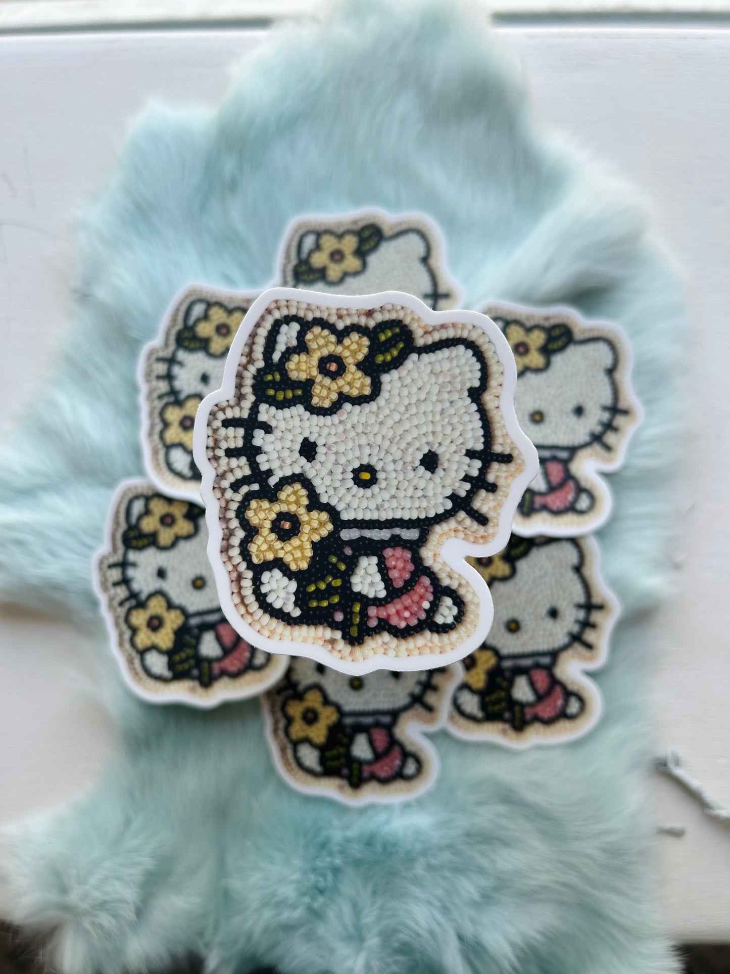 Hello kitty sticker (w/ a flower)